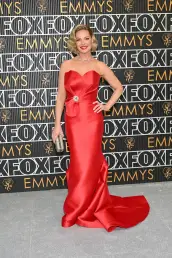 Katherine Heigl poses for photographers on the red carpet at the 75th Emmy Awards